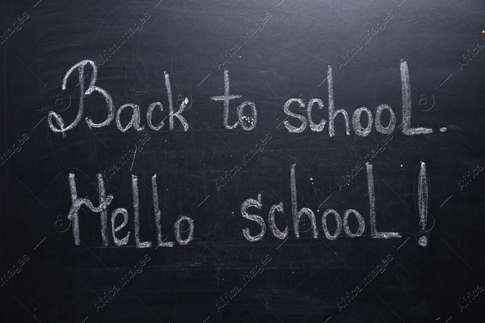 Phrases Back To School and Hello School with exclamation mark on blackboard Photo of Phrases Back To School and Hello School with exclamation mark on blackboard