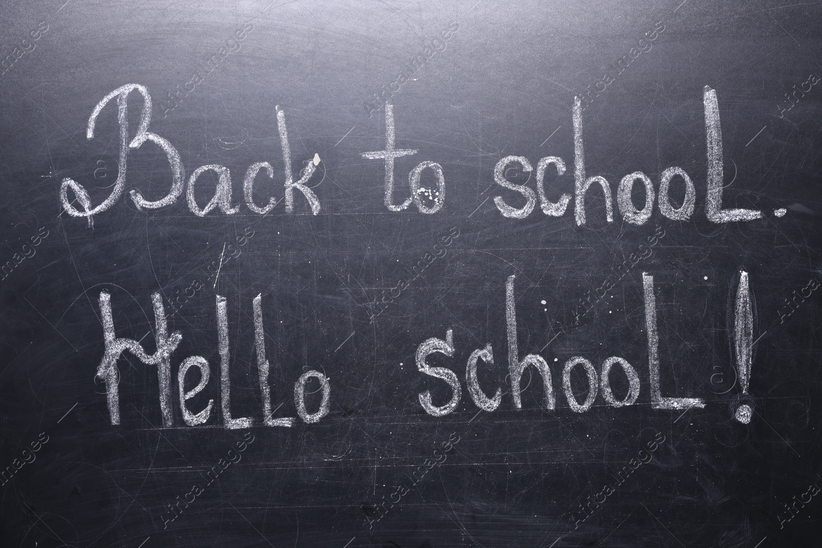 Phrases Back To School and Hello School with exclamation mark on blackboard Photo of Phrases Back To School and Hello School with exclamation mark on blackboard