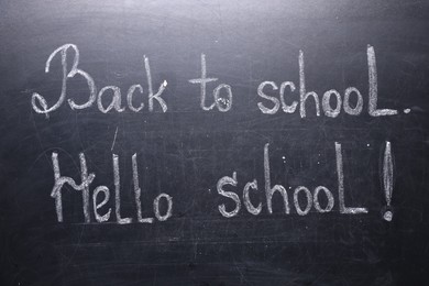 Photo of Phrases Back To School and Hello School with exclamation mark on blackboard