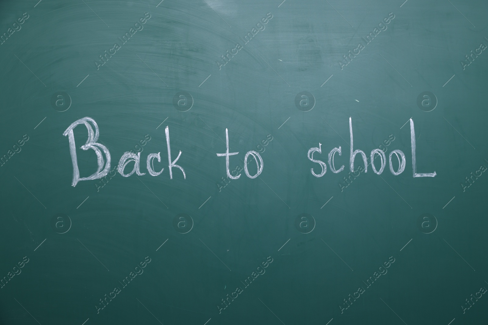 Phrase Back To School written with chalk on blackboard Photo of Phrase Back To School written with chalk on blackboard
