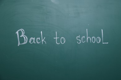 Photo of Phrase Back To School written with chalk on blackboard