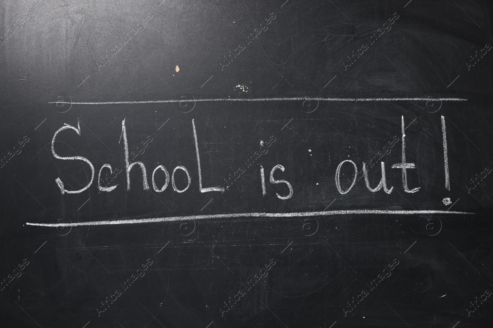 Phrase School's Out with exclamation mark on blackboard Photo of Phrase School's Out with exclamation mark on blackboard