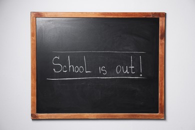 Photo of Phrase School's Out with exclamation mark on blackboard