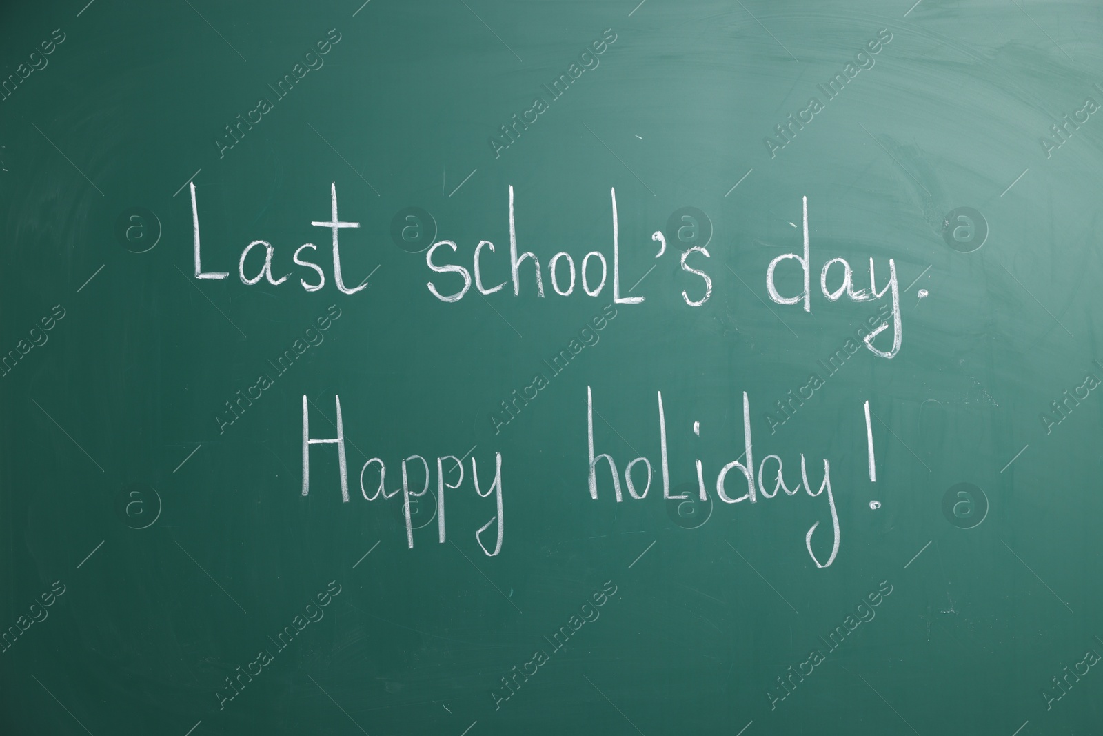 Phrases Last School's Day and Happy Holiday with exclamation mark on blackboard Photo of Phrases Last School's Day and Happy Holiday with exclamation mark on blackboard