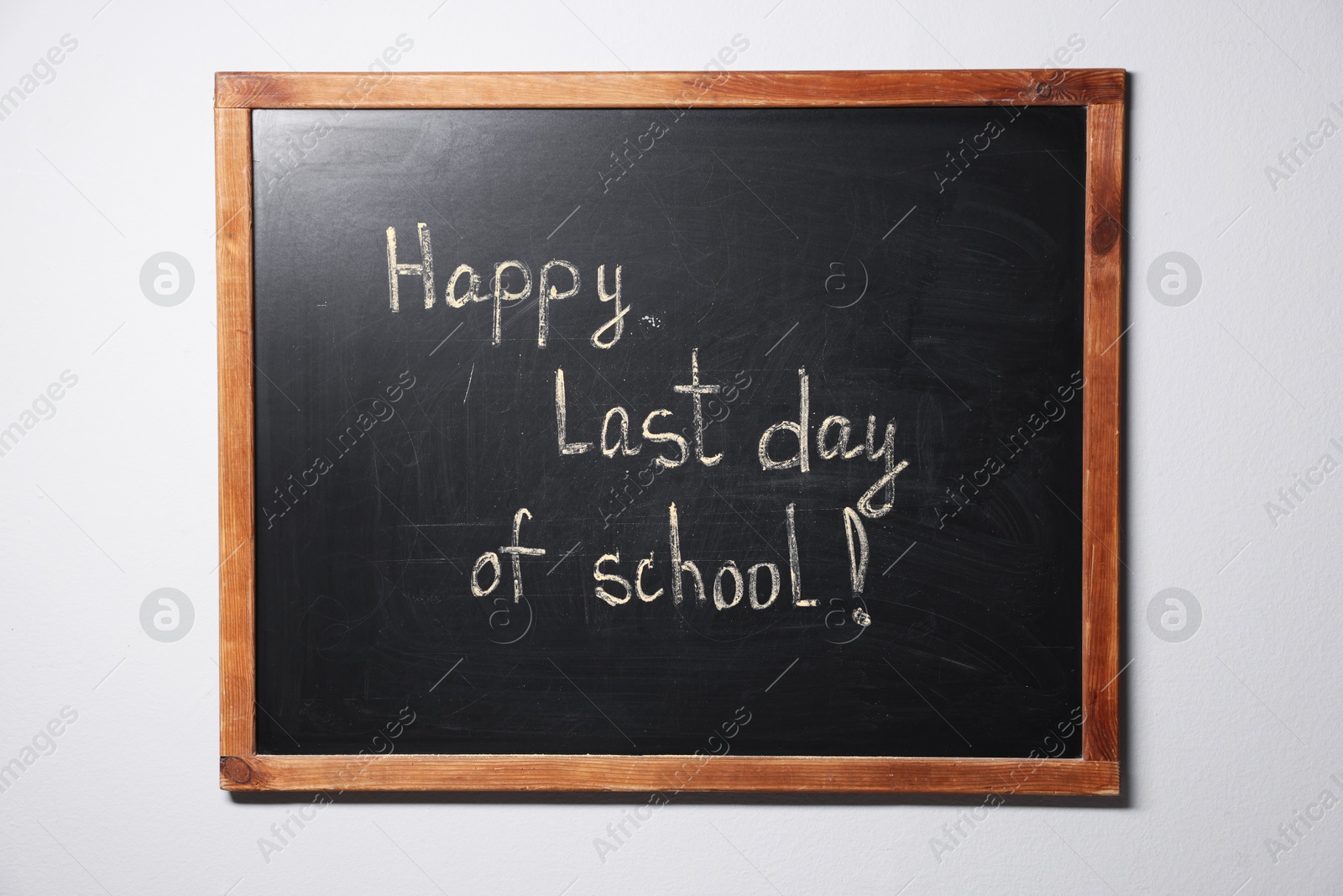 Phrase Happy Last Day of School with exclamation mark on blackboard Photo of Phrase Happy Last Day of School with exclamation mark on blackboard