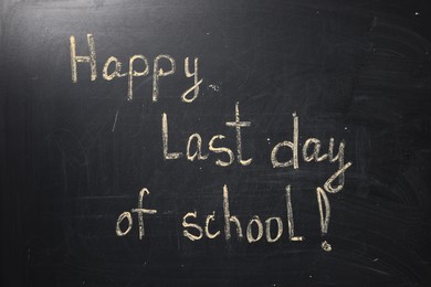 Photo of Phrase Happy Last Day of School with exclamation mark on blackboard