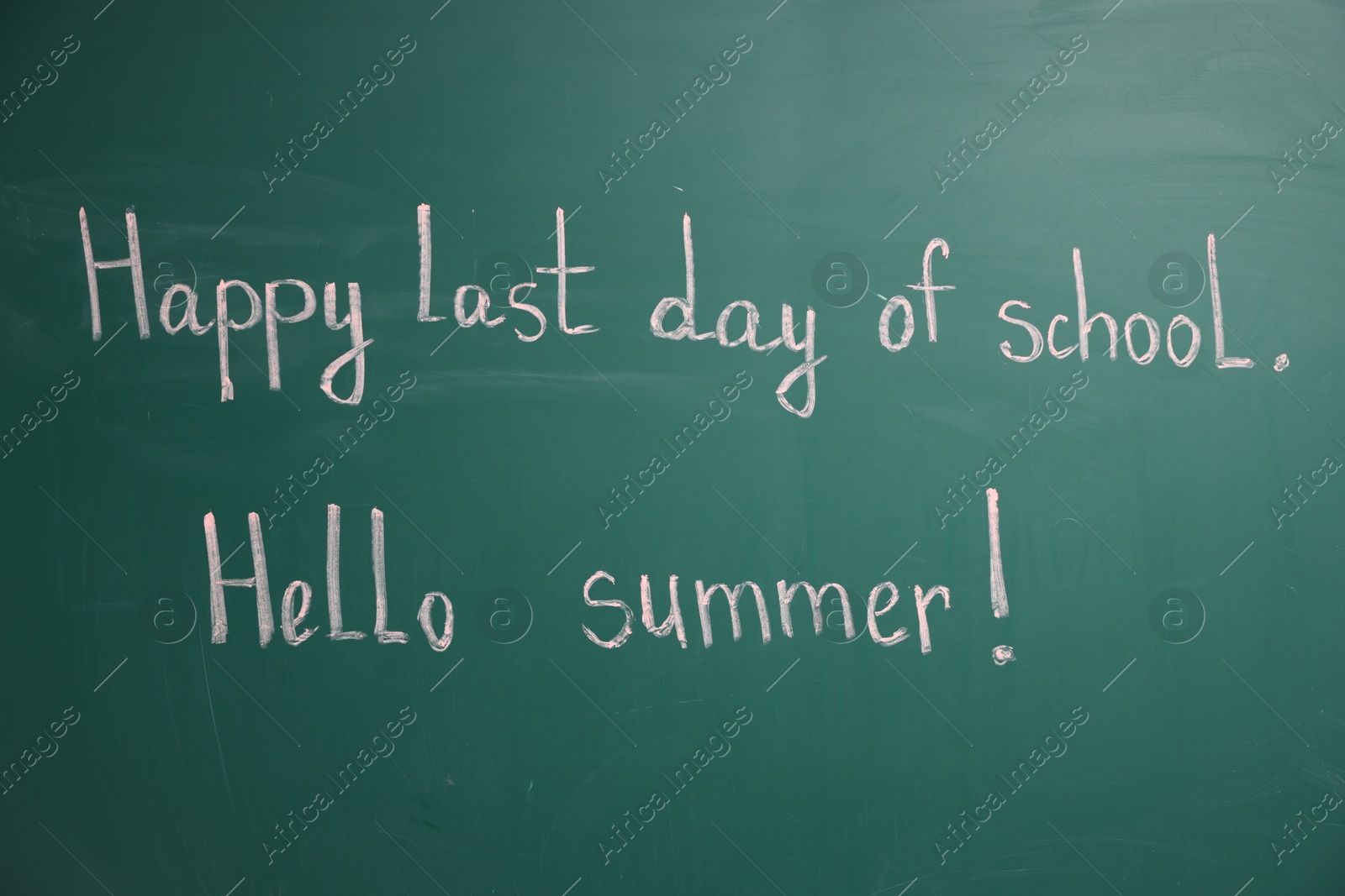 Phrases Happy Last Day of School and Hello Summer with exclamation mark on blackboard Photo of Phrases Happy Last Day of School and Hello Summer with exclamation mark on blackboard