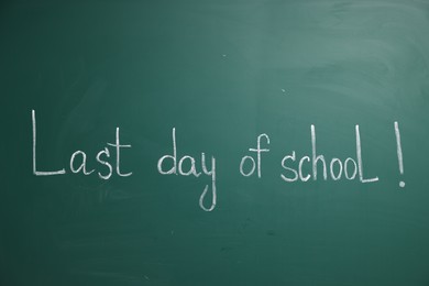 Photo of Phrase Last Day of School with exclamation mark on blackboard
