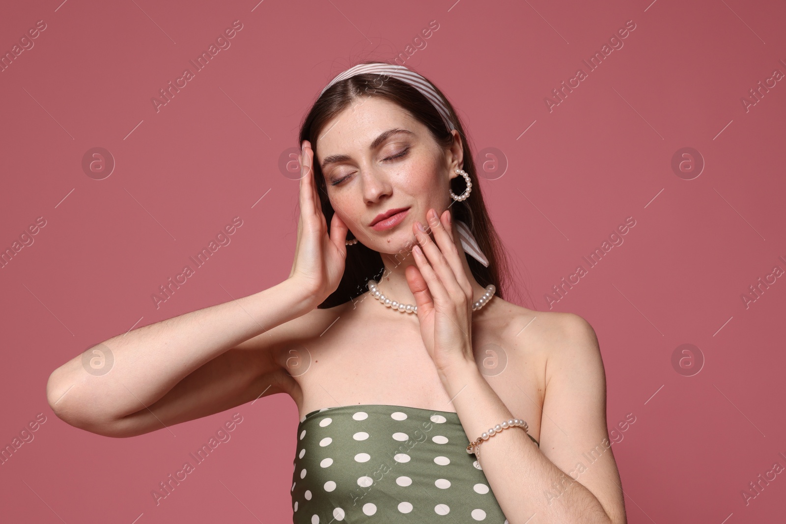 Fashionable portrait of beautiful woman in stylish outfit on pink background Photo of Fashionable portrait of beautiful woman in stylish outfit on pink background