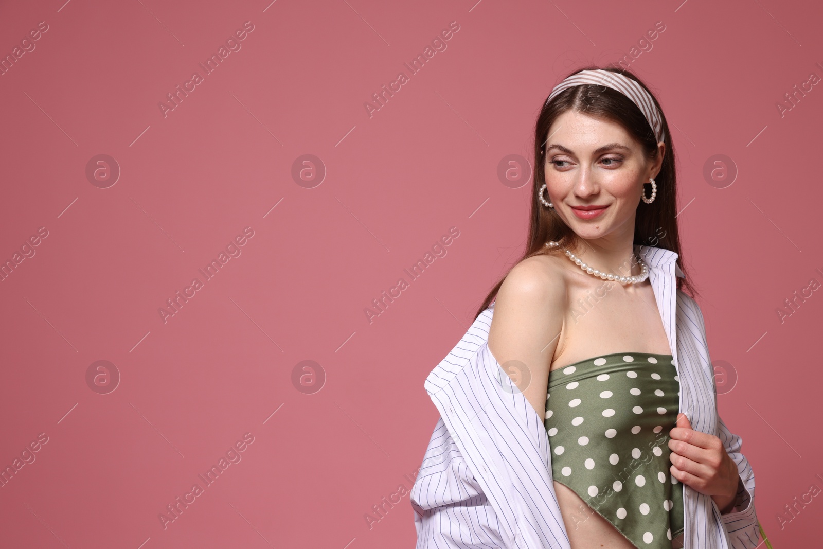 Fashionable portrait of beautiful woman in stylish outfit on pink background. Space for text Photo of Fashionable portrait of beautiful woman in stylish outfit on pink background. Space for text