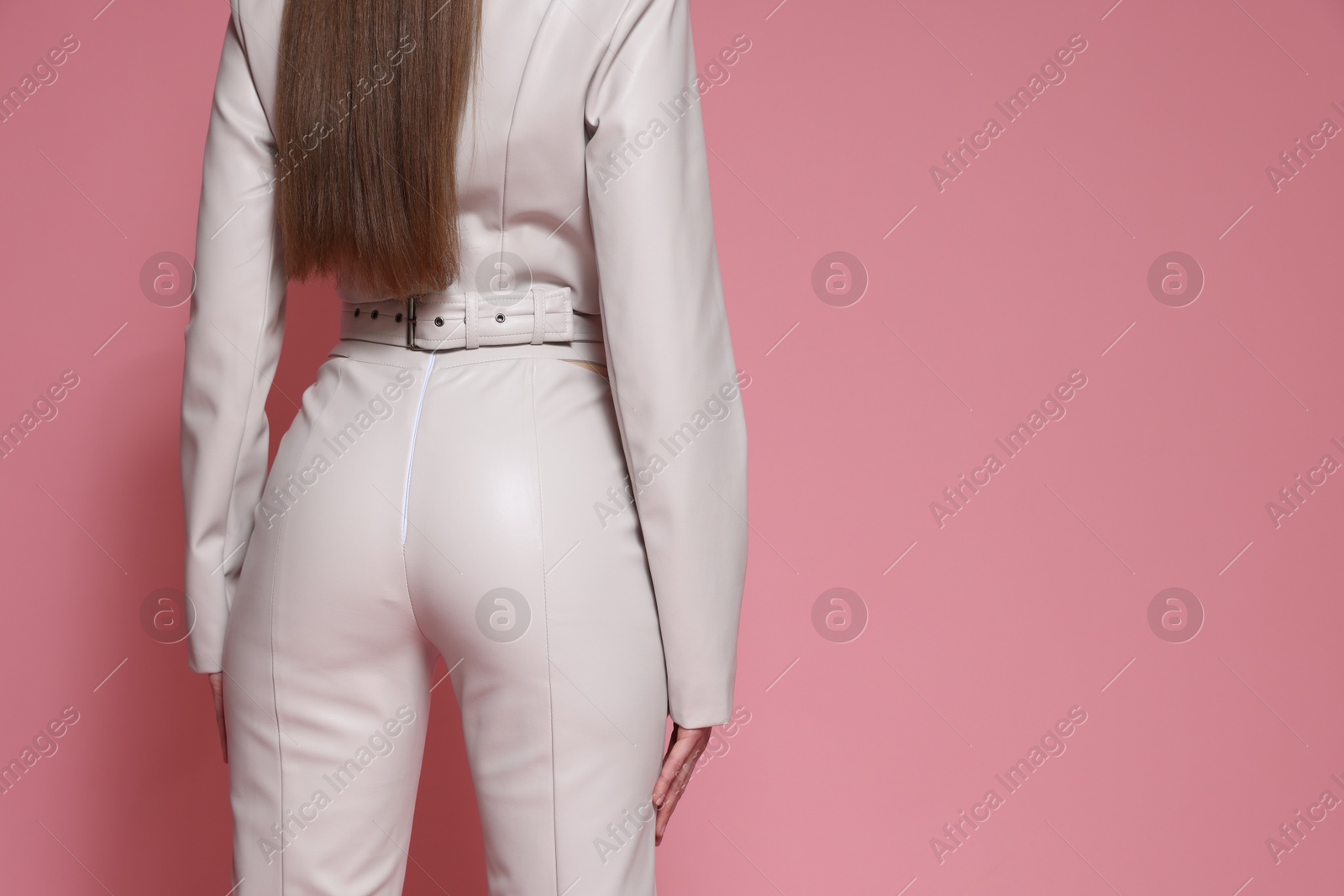 Woman in stylish outfit on pink background, closeup. Space for text Photo of Woman in stylish outfit on pink background, closeup. Space for text