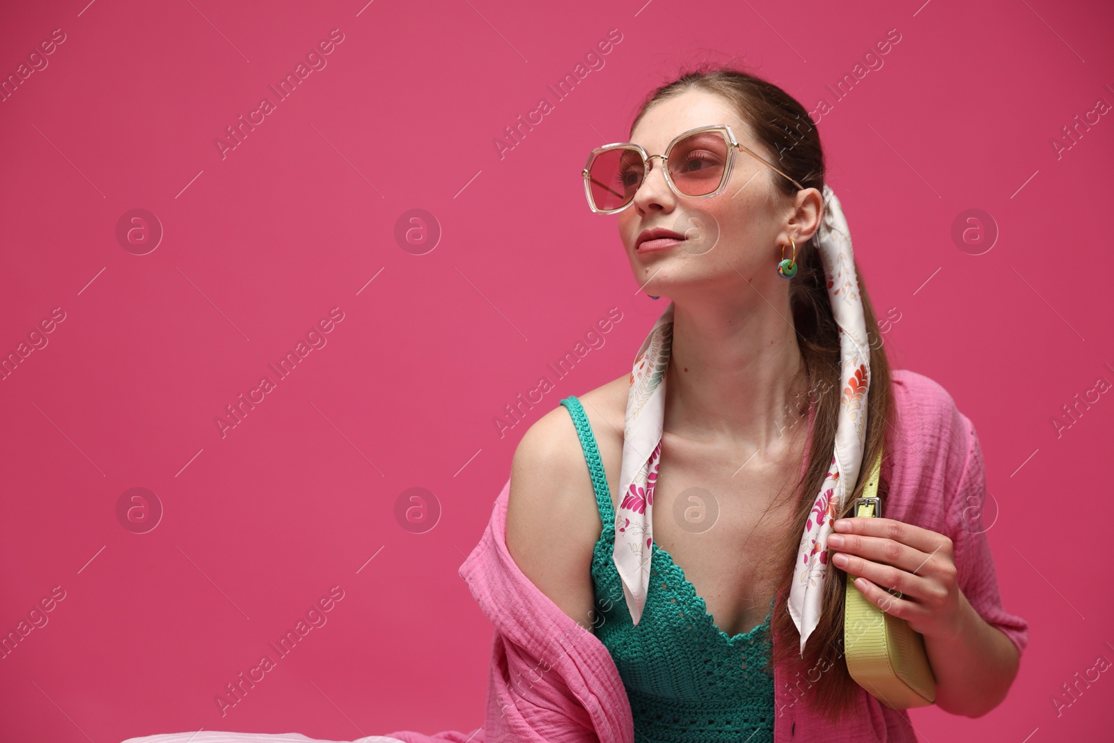 Fashionable portrait of beautiful woman in stylish outfit on pink background. Space for text Photo of Fashionable portrait of beautiful woman in stylish outfit on pink background. Space for text