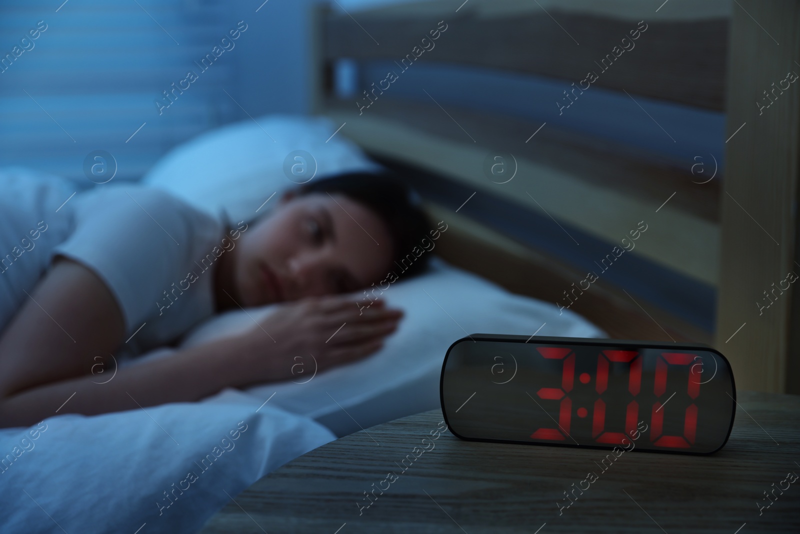 Frustrated young woman suffering from insomnia on bed indoors, selective focus Photo of Frustrated young woman suffering from insomnia on bed indoors, selective focus