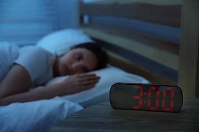 Photo of Frustrated young woman suffering from insomnia on bed indoors, selective focus