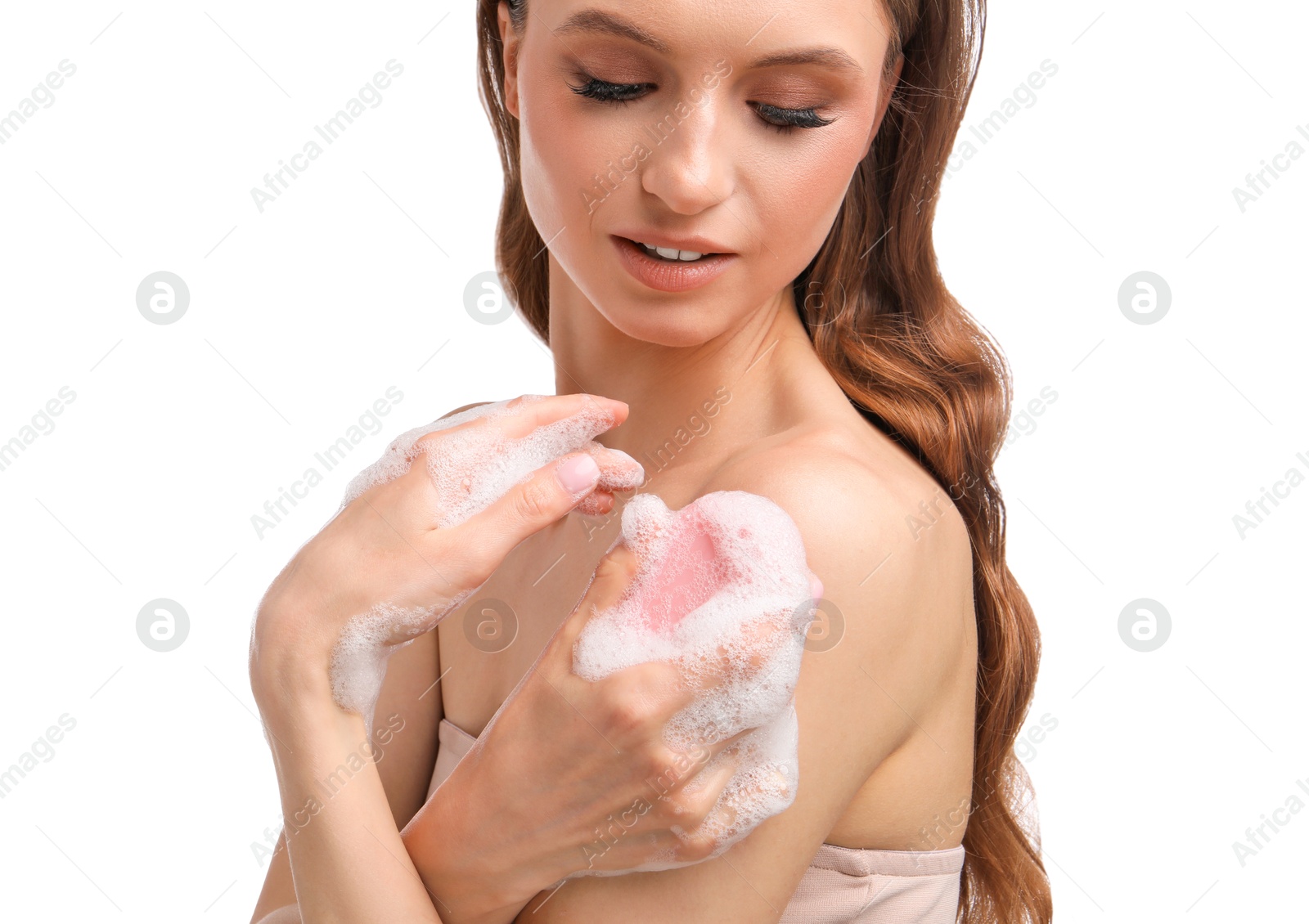 Smiling woman washing body with soap bar on white background, closeup Photo of Smiling woman washing body with soap bar on white background, closeup