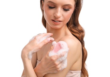 Photo of Smiling woman washing body with soap bar on white background, closeup