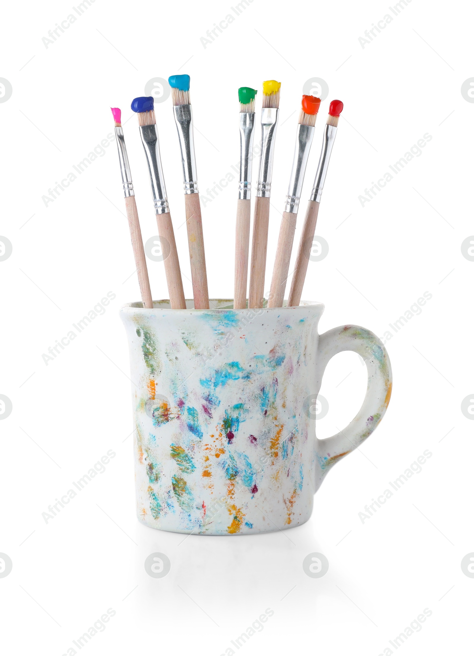 Brushes with color paints in cup isolated on white Photo of Brushes with color paints in cup isolated on white