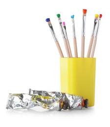 Photo of Brushes with color paints isolated on white