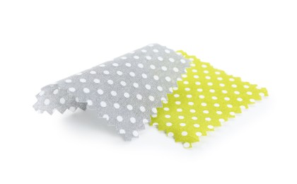 Photo of Samples of fabrics with polka dot pattern isolated on white