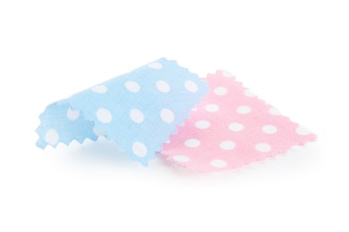 Photo of Samples of fabrics with polka dot pattern isolated on white