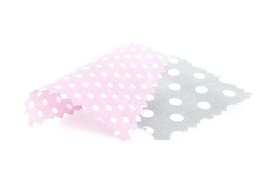 Photo of Samples of fabrics with polka dot pattern isolated on white