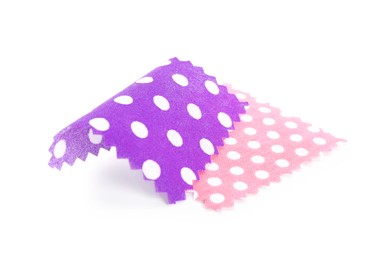 Photo of Samples of fabrics with polka dot pattern isolated on white