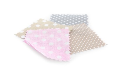 Photo of Samples of fabrics with polka dot pattern isolated on white