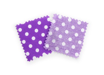 Photo of Samples of fabrics with polka dot pattern isolated on white, top view