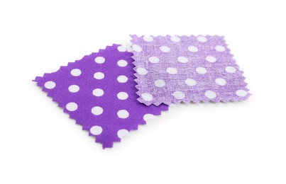Photo of Samples of fabrics with polka dot pattern isolated on white