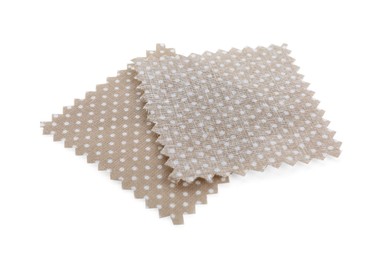 Photo of Samples of fabrics with polka dot pattern isolated on white