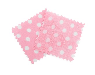 Photo of Samples of fabrics with polka dot pattern isolated on white, top view