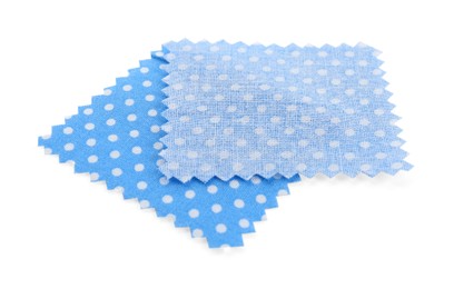 Photo of Samples of fabrics with polka dot pattern isolated on white
