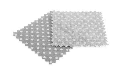 Photo of Samples of fabrics with polka dot pattern isolated on white