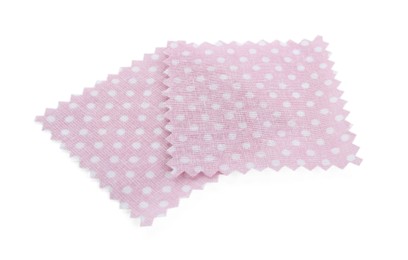 Photo of Samples of fabrics with polka dot pattern isolated on white