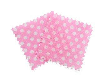 Photo of Samples of fabrics with polka dot pattern isolated on white, top view