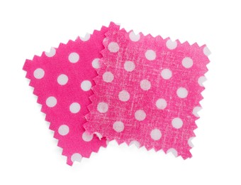 Photo of Samples of fabrics with polka dot pattern isolated on white, top view