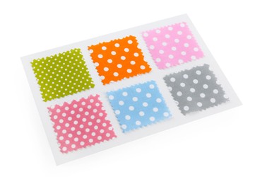 Photo of Samples of fabrics with polka dot pattern isolated on white