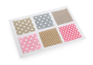 Photo of Samples of fabrics with polka dot pattern isolated on white