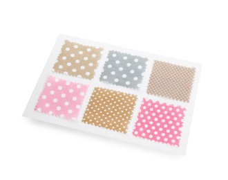 Photo of Samples of fabrics with polka dot pattern isolated on white