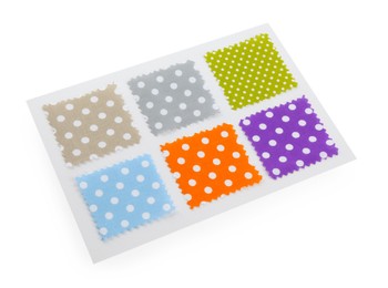 Photo of Samples of fabrics with polka dot pattern isolated on white