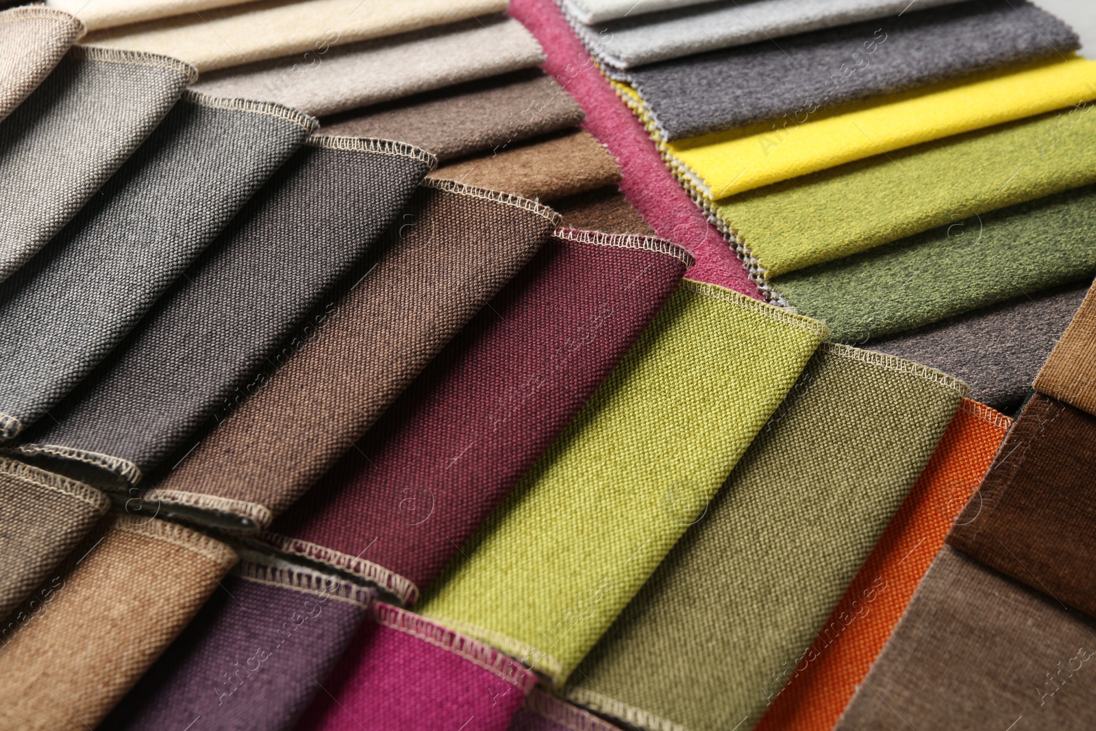 Samples of different fabrics as background, closeup Photo of Samples of different fabrics as background, closeup