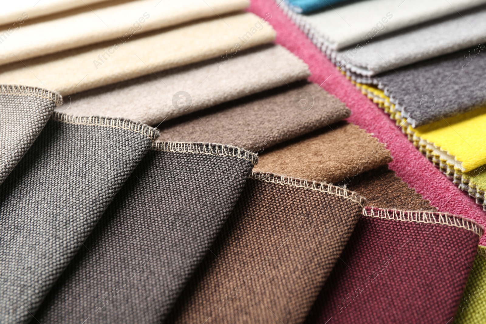 Samples of different fabrics as background, closeup Photo of Samples of different fabrics as background, closeup