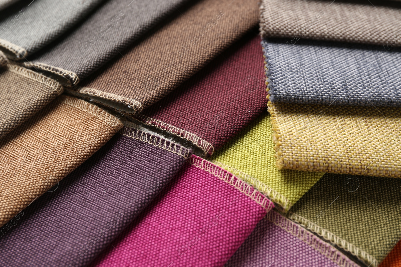 Samples of different fabrics as background, closeup Photo of Samples of different fabrics as background, closeup