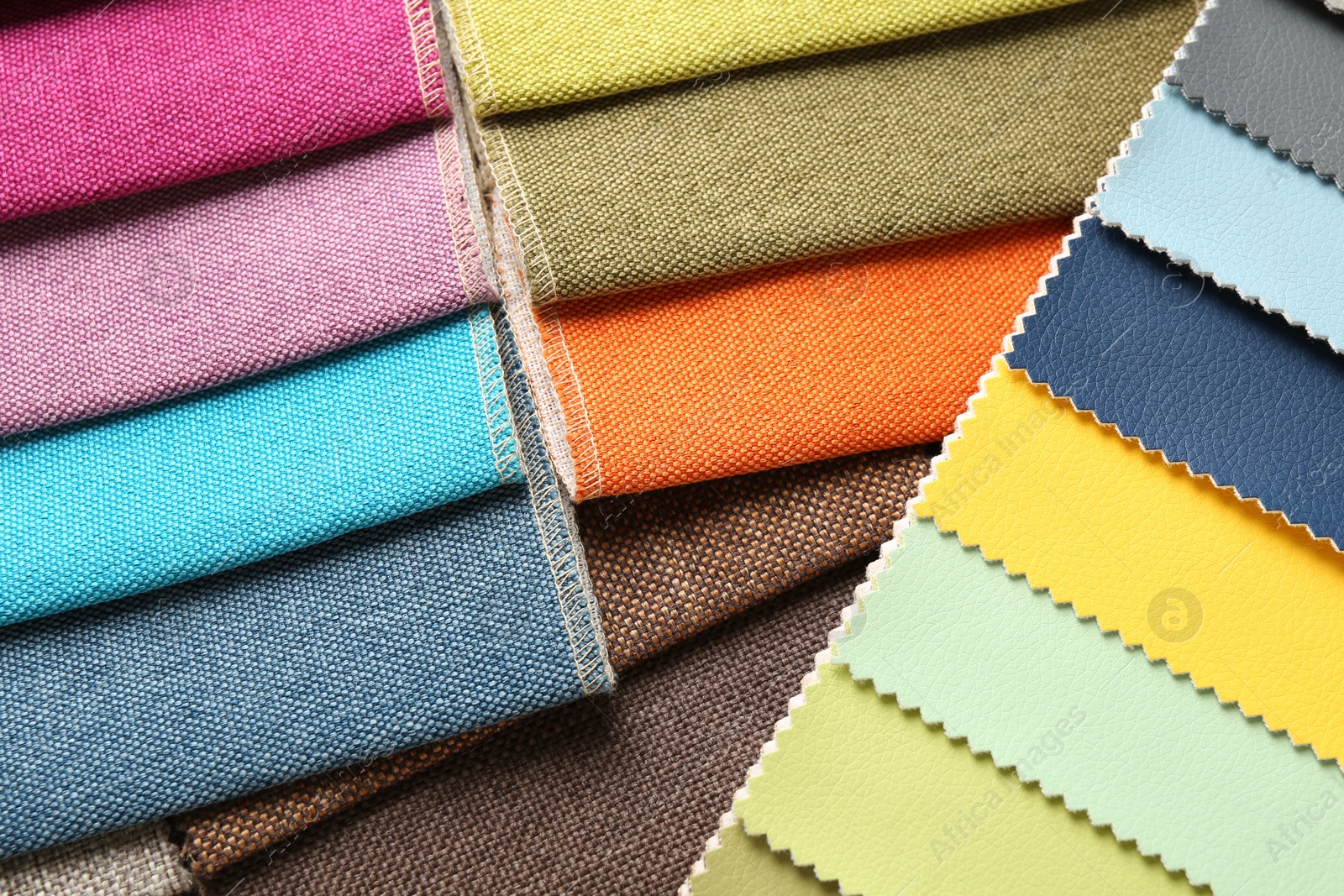Samples of different fabrics as background, closeup Photo of Samples of different fabrics as background, closeup