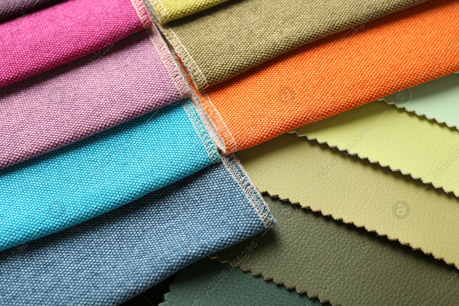 Samples of different fabrics as background, closeup Photo of Samples of different fabrics as background, closeup