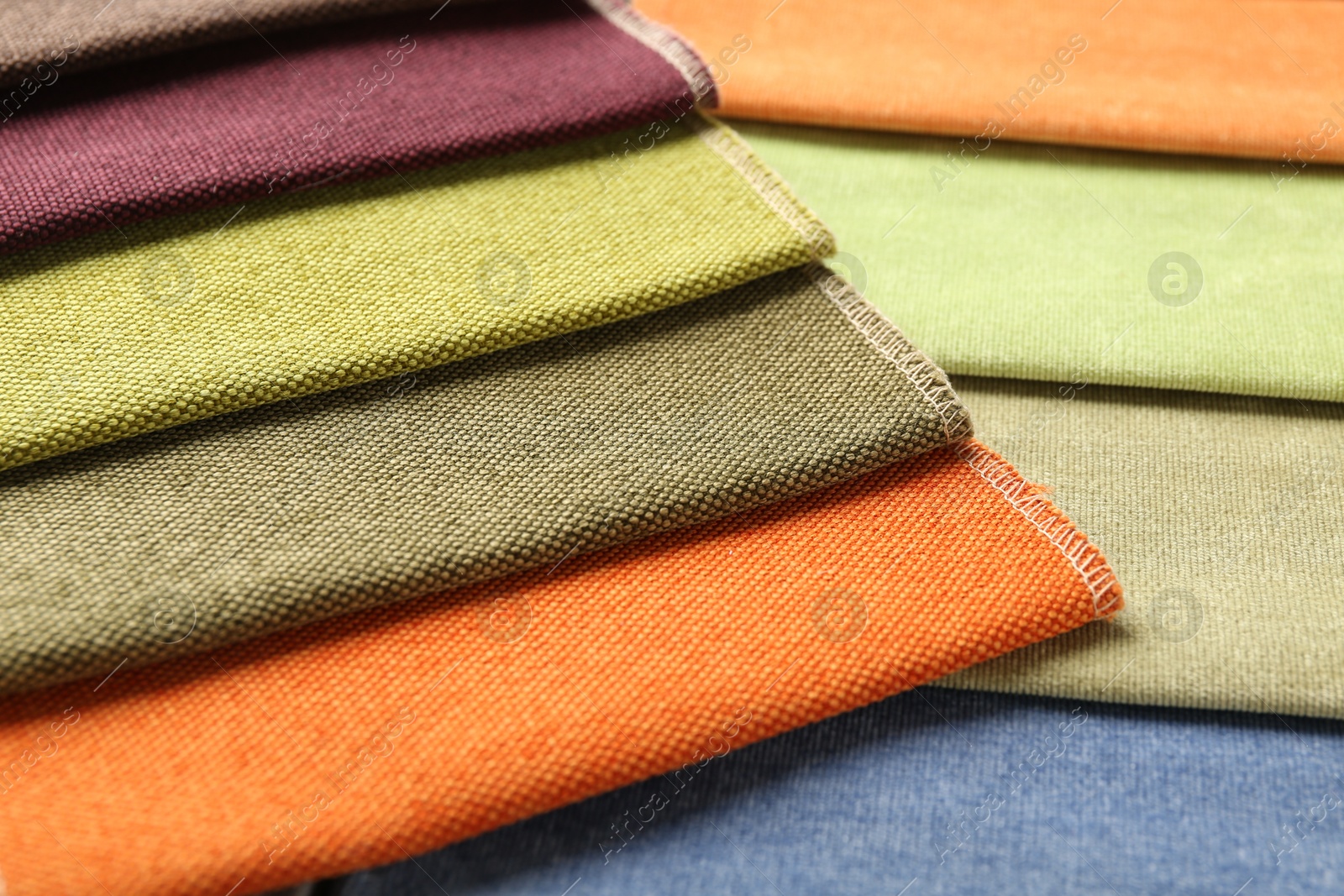 Samples of different fabrics as background, closeup Photo of Samples of different fabrics as background, closeup