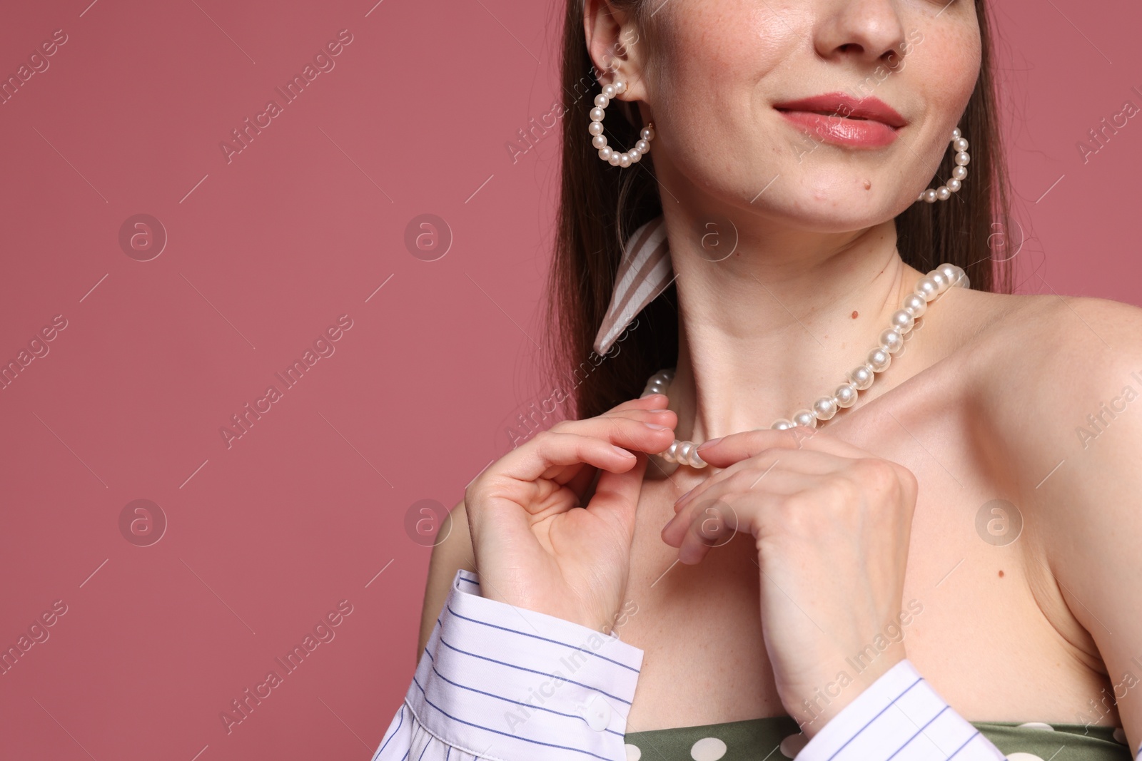 Woman with beautiful accessories on pink background, closeup. Space for text Photo of Woman with beautiful accessories on pink background, closeup. Space for text