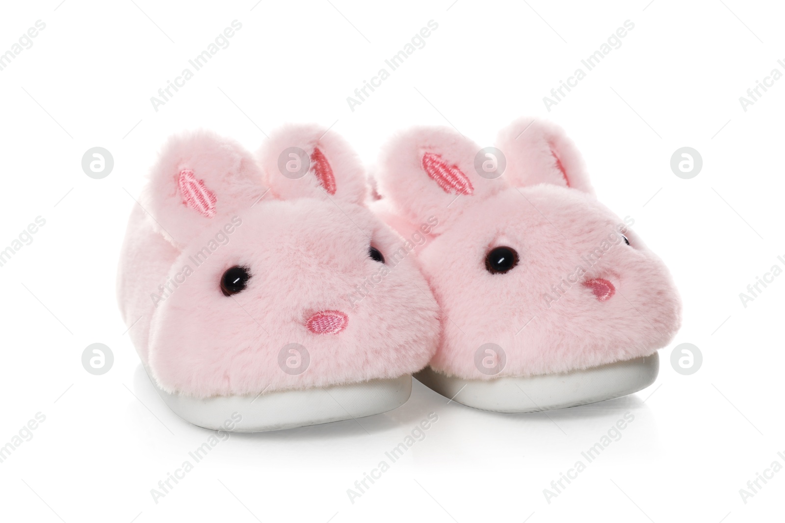 Cute kid slippers in shape of bunnies isolated on white Photo of Cute kid slippers in shape of bunnies isolated on white