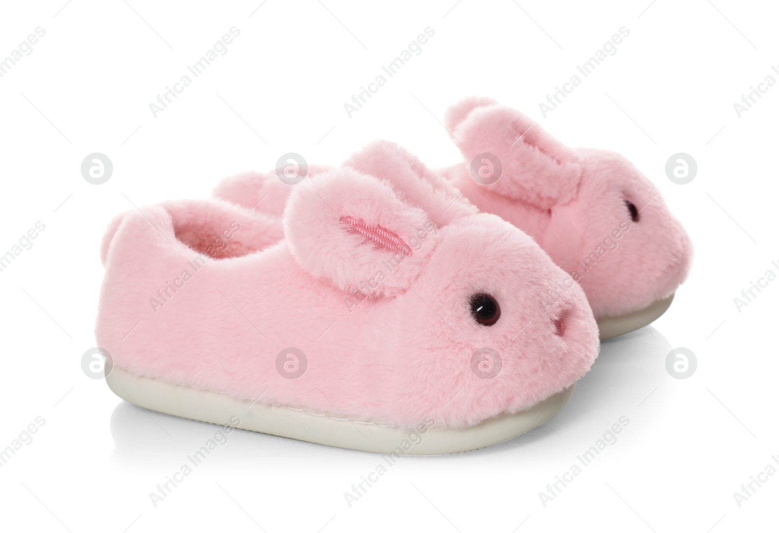 Cute kid slippers in shape of bunnies isolated on white Photo of Cute kid slippers in shape of bunnies isolated on white