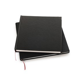Photo of Two stylish hardcover notebooks isolated on white